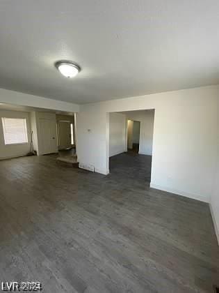 spare room featuring dark hardwood / wood-style flooring