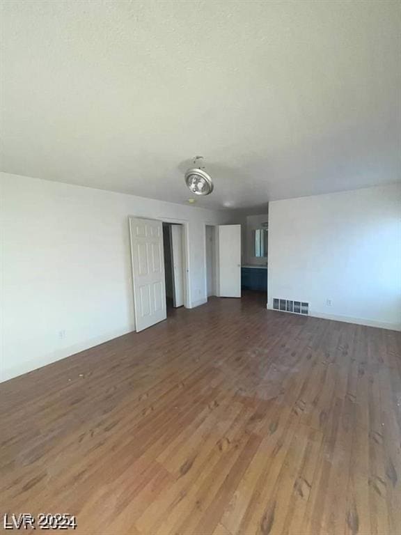 spare room featuring dark hardwood / wood-style flooring