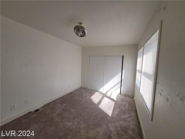 unfurnished room with carpet