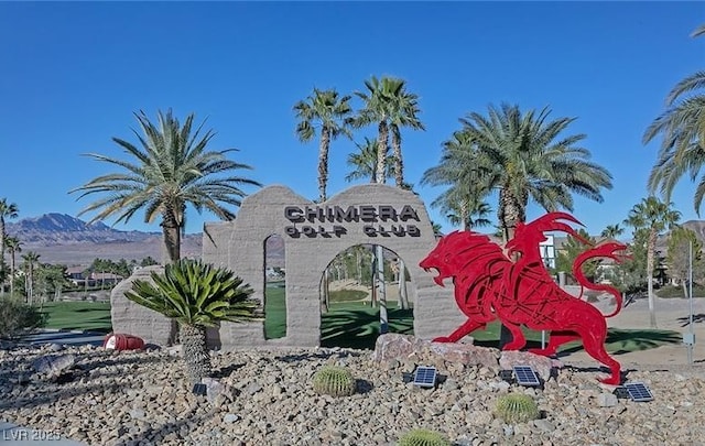 community / neighborhood sign featuring a mountain view