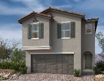 mediterranean / spanish-style home featuring a garage