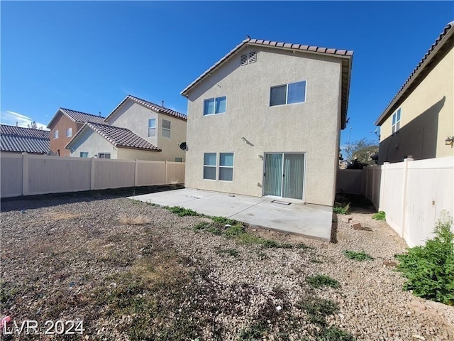 rear view of house featuring a patio area