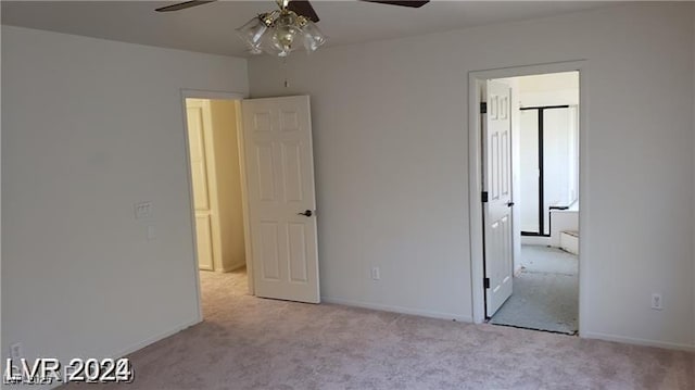 unfurnished bedroom featuring ceiling fan and light colored carpet