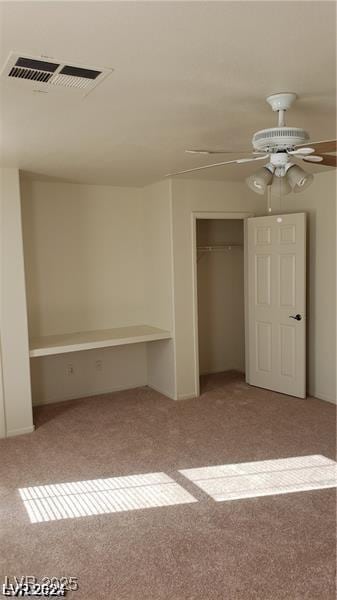 unfurnished bedroom featuring ceiling fan and light colored carpet