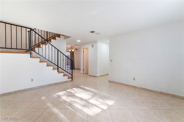 interior space featuring ceiling fan and light tile patterned floors