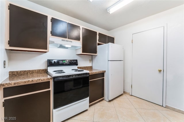 kitchen with white appliances and light tile patterned floors