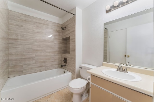 full bathroom featuring tile patterned floors, vanity, tiled shower / bath, and toilet