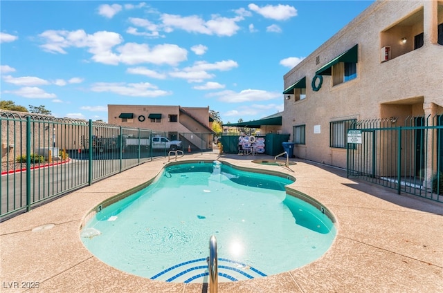 view of swimming pool with a patio