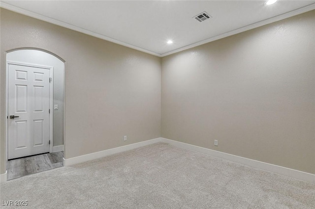 carpeted empty room with ornamental molding