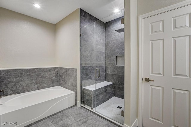 bathroom featuring tile patterned floors and plus walk in shower