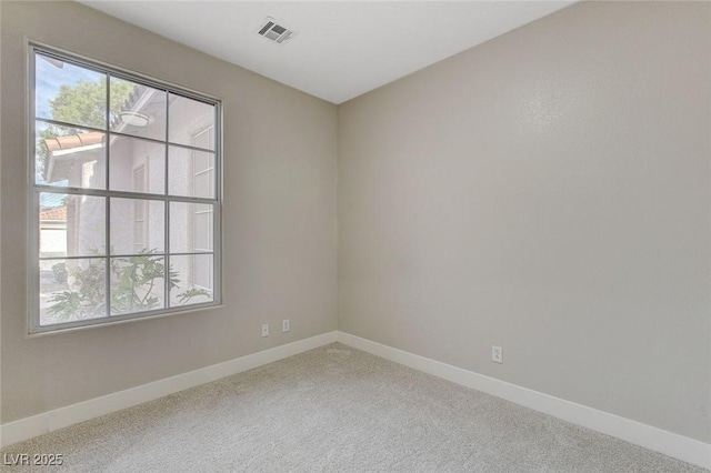 unfurnished room with carpet flooring