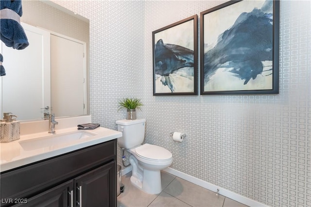 bathroom featuring toilet, vanity, and tile patterned floors