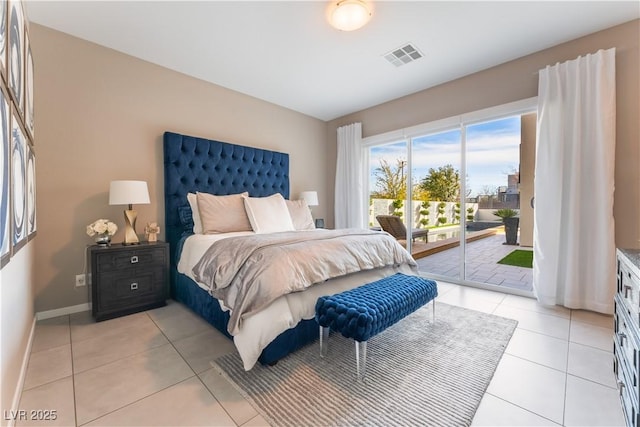 tiled bedroom featuring access to outside