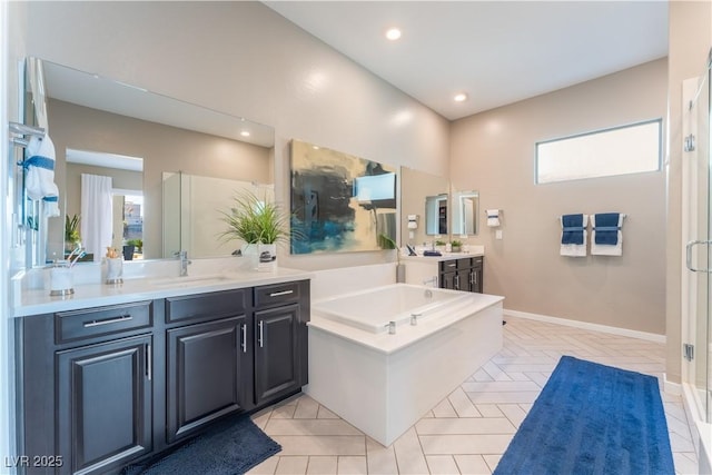 bathroom with separate shower and tub and vanity