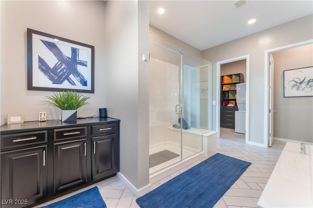 bathroom with an enclosed shower and vanity