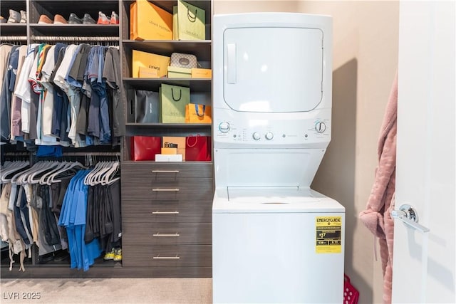 clothes washing area with stacked washer and dryer