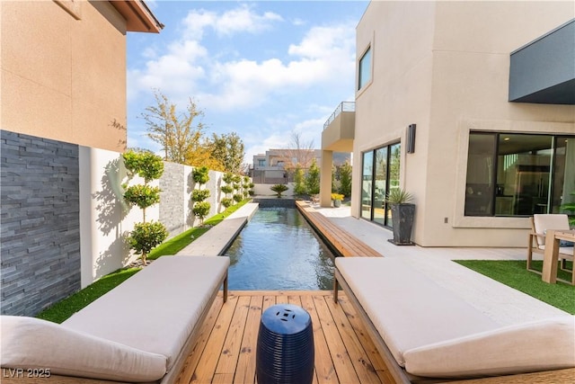 view of pool featuring a deck