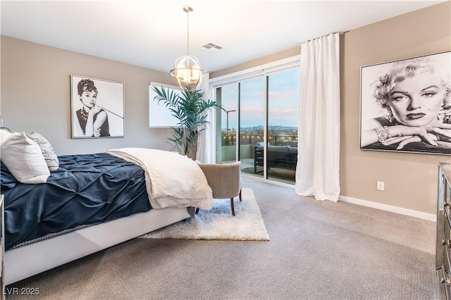 carpeted bedroom featuring access to outside