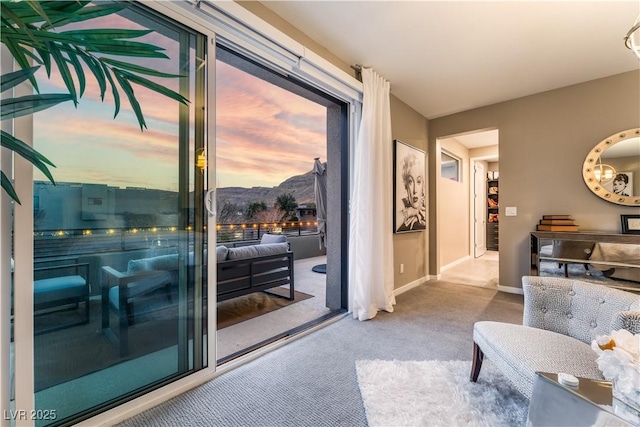 living room featuring light colored carpet and a mountain view