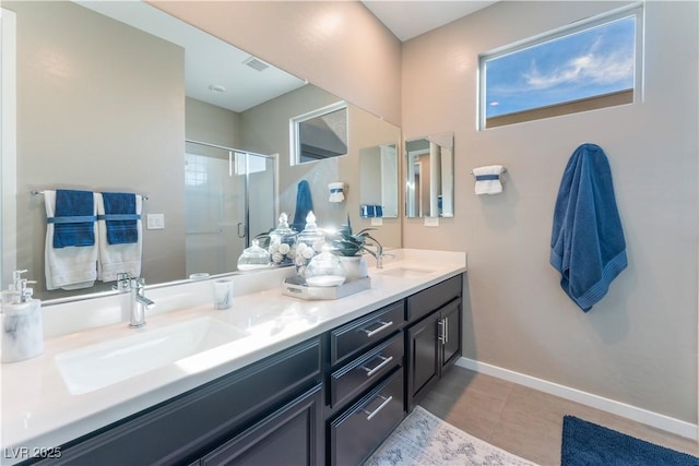 bathroom with an enclosed shower and vanity