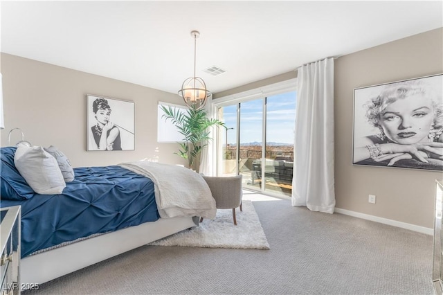 carpeted bedroom featuring access to outside