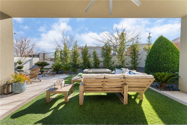 exterior space featuring a lawn, a patio area, and outdoor lounge area