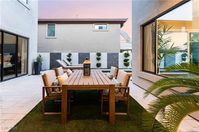 patio terrace at dusk with outdoor lounge area