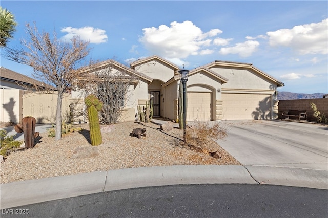 view of front of home with a mountain view and a garage