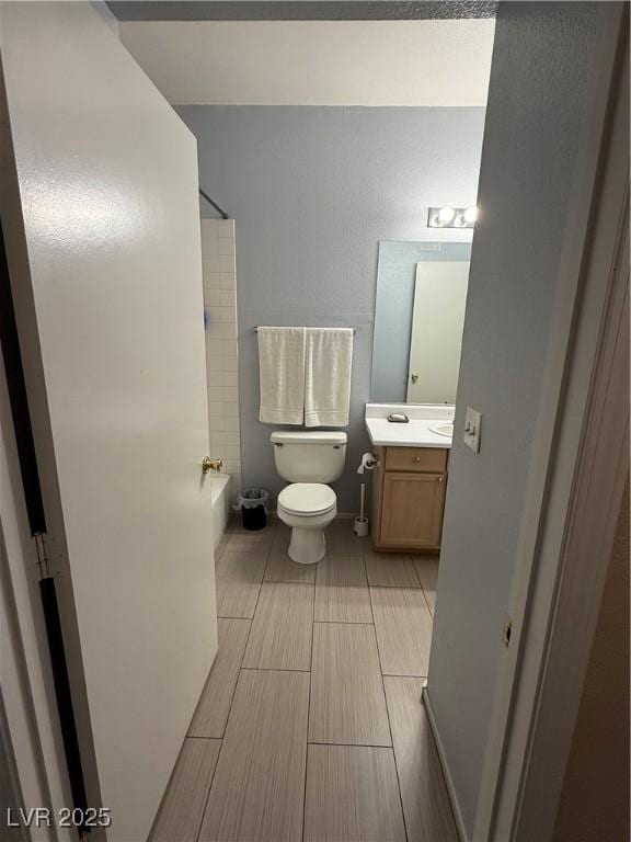 full bathroom featuring vanity, toilet, and shower / bathtub combination