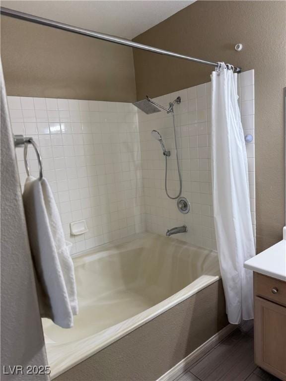 bathroom with vanity and shower / tub combo with curtain