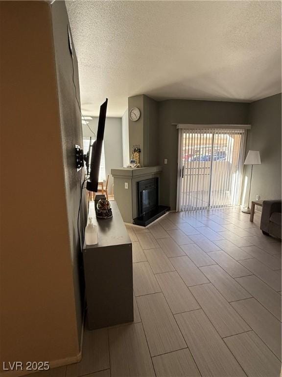 living room featuring a textured ceiling