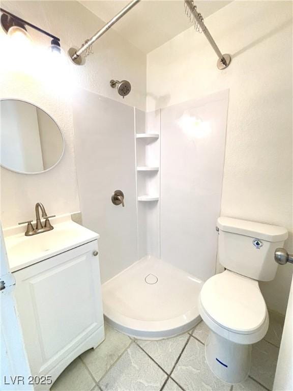 bathroom with vanity, tile patterned floors, and walk in shower