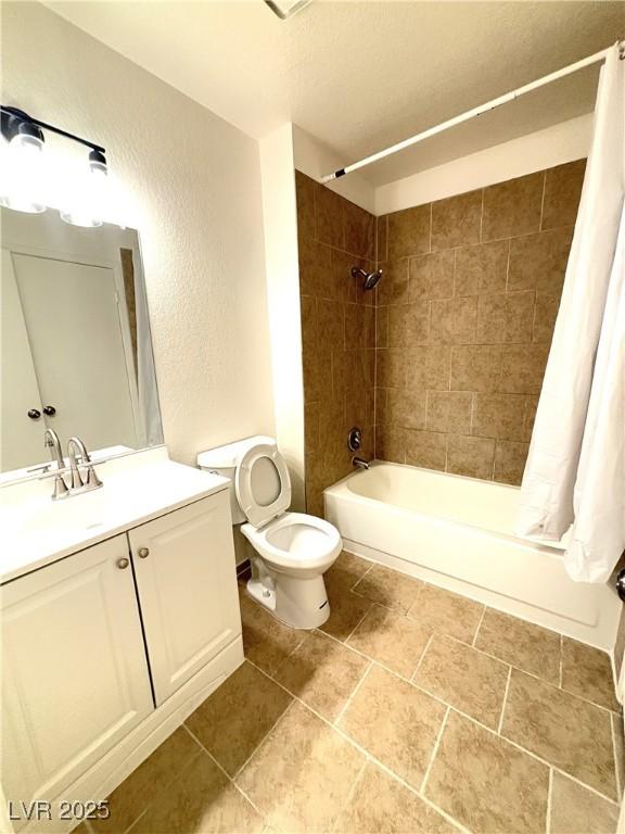 full bathroom with vanity, shower / bathtub combination with curtain, and toilet