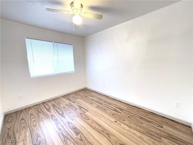 unfurnished room with light hardwood / wood-style floors and ceiling fan