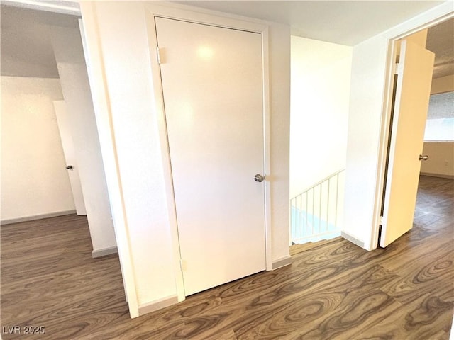 hall with dark hardwood / wood-style floors