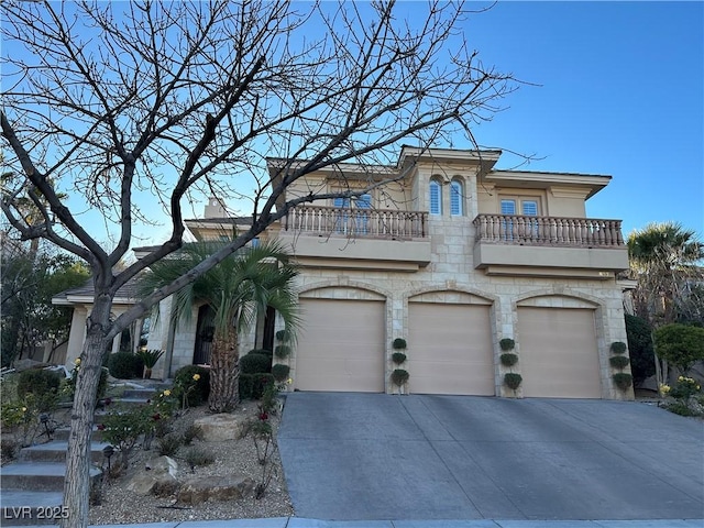 view of front of house featuring a balcony and a garage