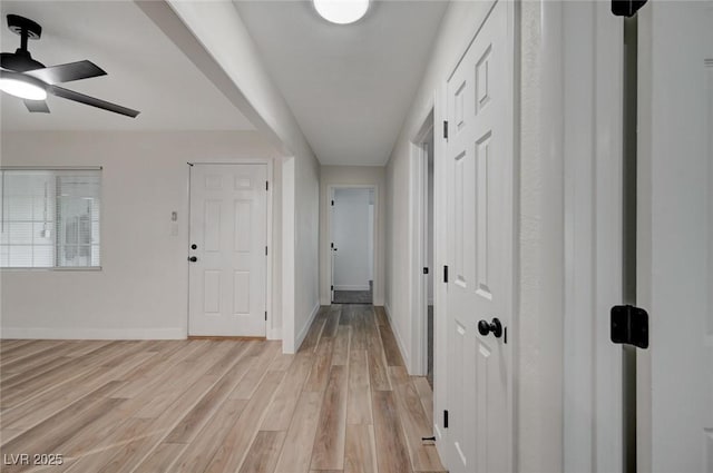 corridor featuring light hardwood / wood-style floors