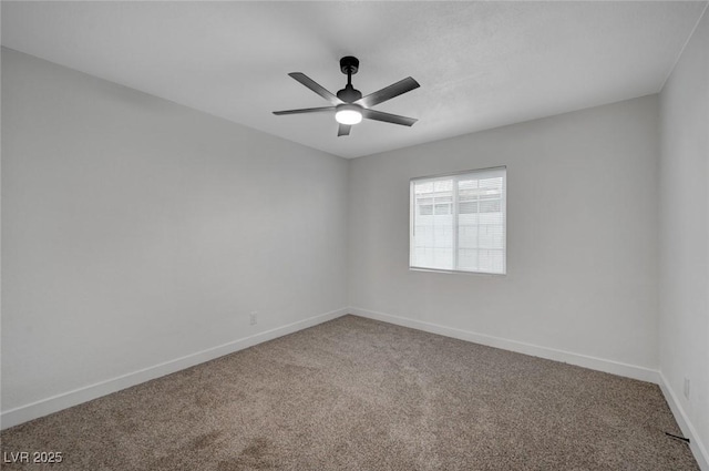 carpeted empty room featuring ceiling fan