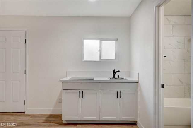 bathroom featuring vanity and hardwood / wood-style floors