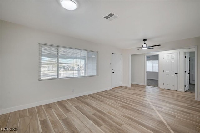 spare room with ceiling fan and light hardwood / wood-style floors