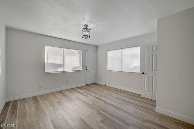 spare room featuring light wood-type flooring