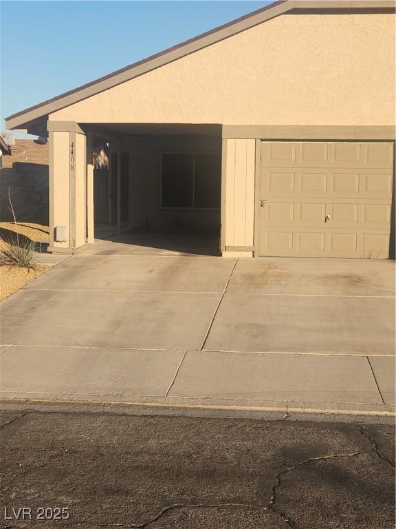 exterior space with a carport