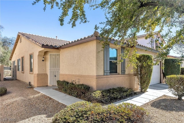 mediterranean / spanish-style house featuring a garage