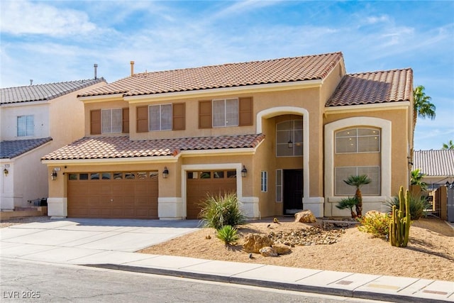 mediterranean / spanish-style house featuring a garage