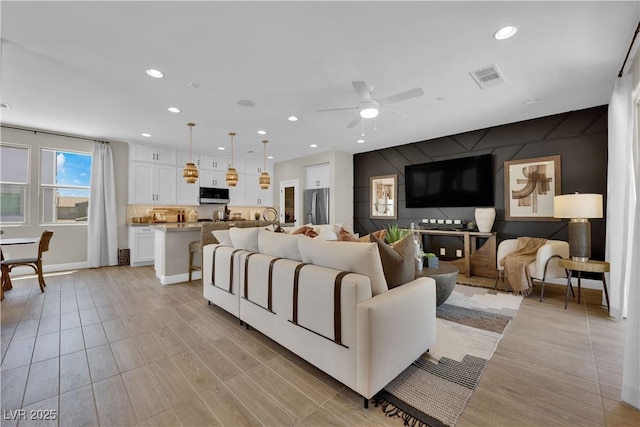 living room featuring ceiling fan