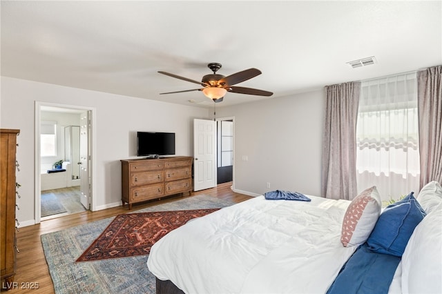 bedroom with hardwood / wood-style flooring and ceiling fan