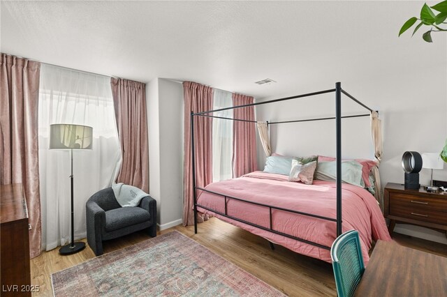 bedroom featuring light hardwood / wood-style floors