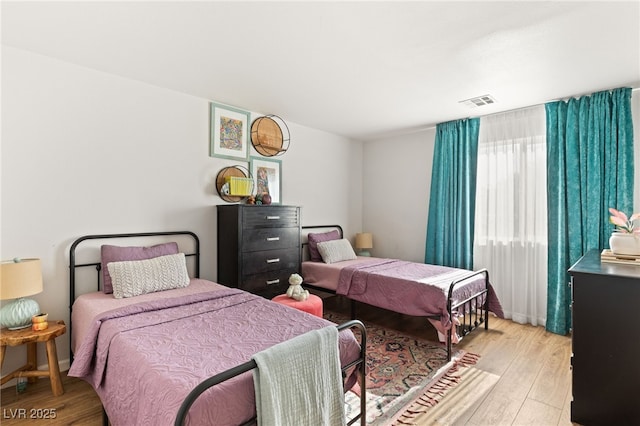 bedroom featuring light hardwood / wood-style floors