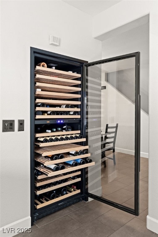 wine area featuring tile patterned flooring