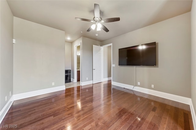 unfurnished living room with wood-type flooring and ceiling fan